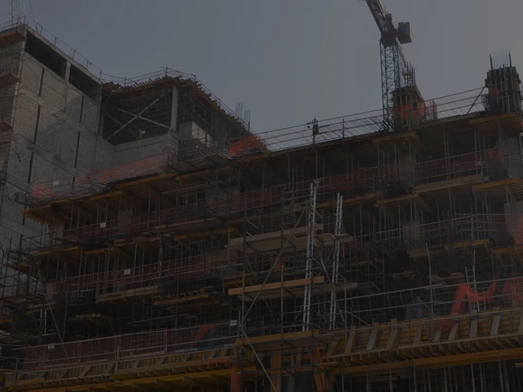 Building under construction with a tower crane overhead