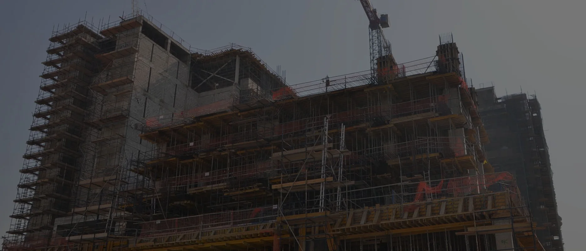 Construction site in Qatar with tower crane and scaffolding